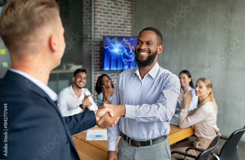Cuadro en lienzo A CEO greets a new employee with a handshake in a boardroom