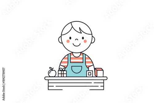 A smiling child wearing overalls, sitting at a table with an apple and blocks