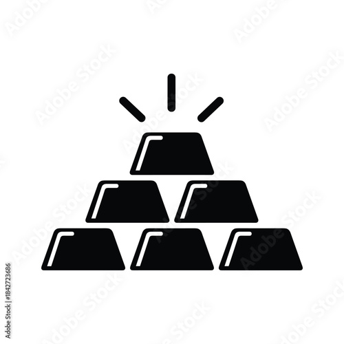 Stack of gold bars with shining top bar