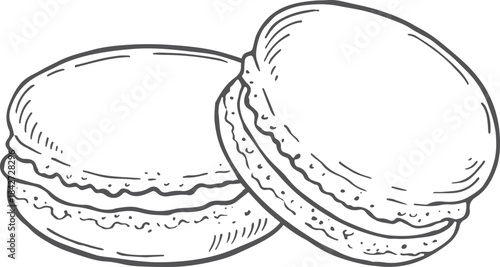 Two macarons are sitting on a white background