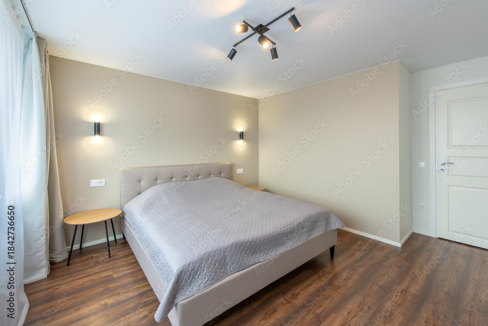 Naklejka premium Minimalism Bedroom Interior. Wardrobe in Background. Coffee Table and Light. Windows and Curtains. Home.