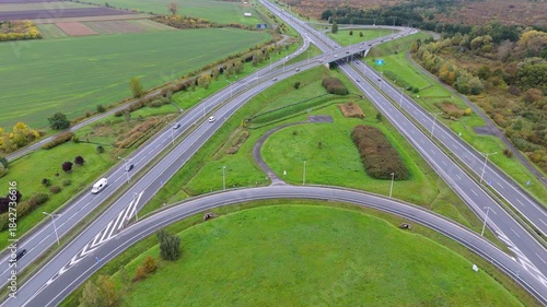 Traffic flows and road designs at an intersection during autumn