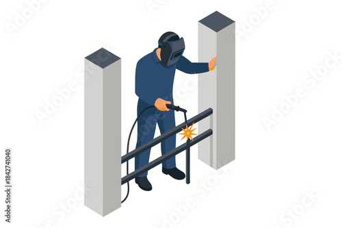 Worker in protective gear welding metal barrier sections