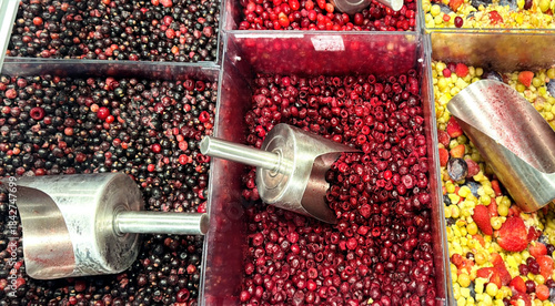 buying fruits and  berries ( cranberries, currants)at the market