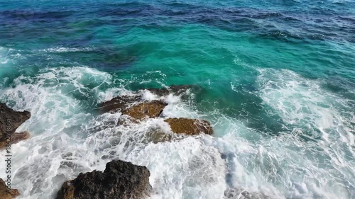 Sea Caves and Turquoise Water Along Rocky Coastline