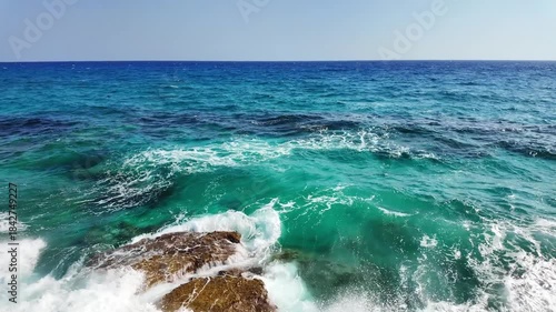 Sea Caves and Turquoise Water Along Rocky Coastline