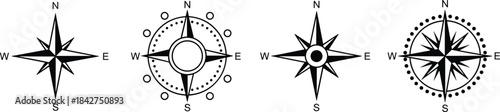 A diverse set of four black and white compass rose icons showcasing different styles for navigation, exploration, and geographic direction, indicating North, South, East, and West.