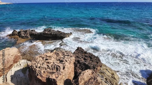 Sea Caves and Turquoise Water Along Rocky Coastline