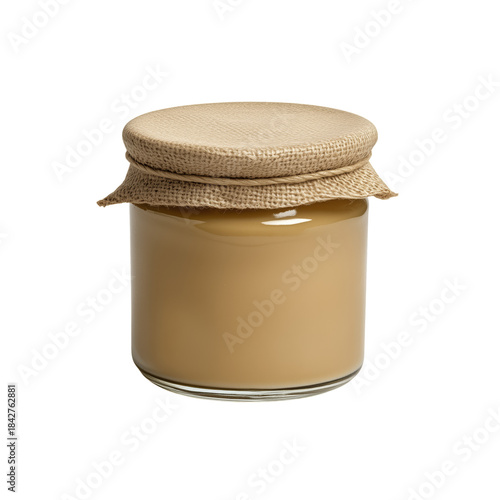 Homemade Candle in Glass Jar With Burlap Lid on a Plain Background