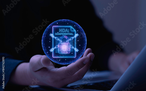 Businessman holding virtual NDA document with digital lock. Concept of confidentiality agreement, encrypted document, trade secrets, and secure file transfer.