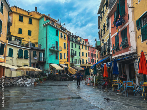 Fototapeta Naklejka Na Ścianę i Meble -  Dramatic colorful street in Vernazza, Italy on a cold and rainy day, capturing the streets of the world famous village.