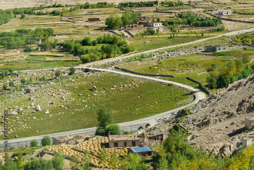 Curvy road of Leh with green land view from top, Ladakh, Union territory, India. Top view of himalayan mountains.