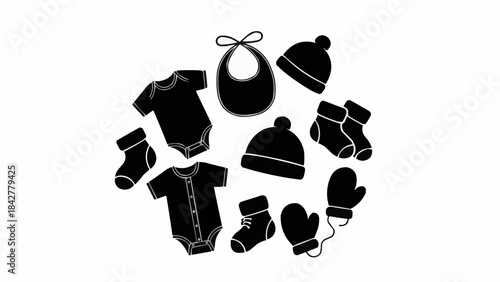 Collection of Black Baby Clothing and Accessories Arranged in a Circle.