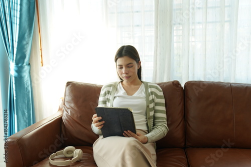 Wallpaper Mural Woman working remotely on laptop while relaxing at home terrace Torontodigital.ca