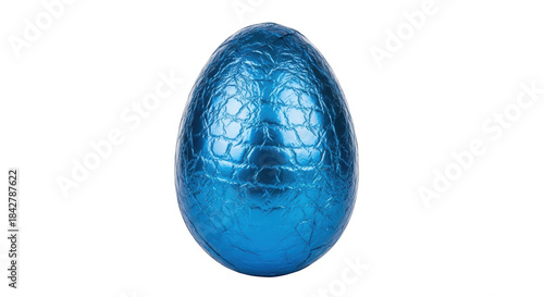 Fotografi Single blue foil wrapped egg on black background chocolate
