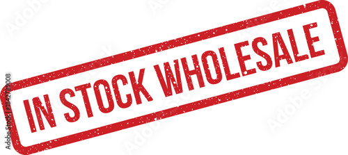 A bold red textured rubber stamp indicating IN STOCK WHOLESALE for large scale business transactions