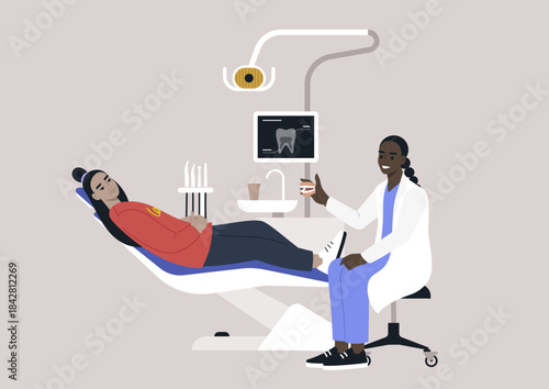 A patient relaxes in a dental chair at a contemporary clinic, while a dentist engages with them showing a dental teaching model, creating a friendly atmosphere for dental care and treatment procedures