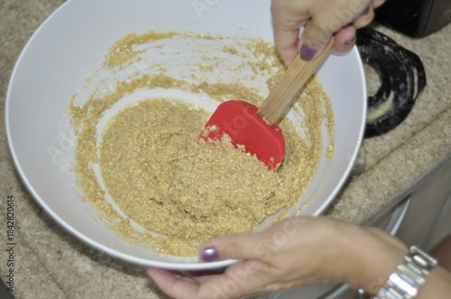 woman making a heart shaped cookie