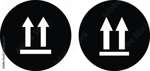 Two black circles with white up arrows and horizontal lines indicating this side up symbol