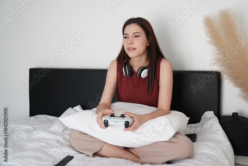 Wallpaper Mural Young women playing video games together in living room. Torontodigital.ca