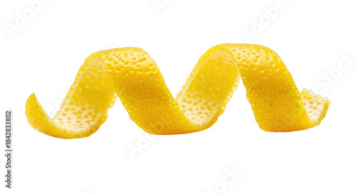 Yellow lemon peel spiral against black background citrus zest twist