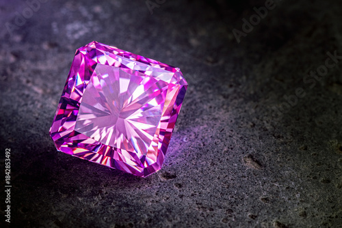 A large purple diamond is sitting on a grey surface