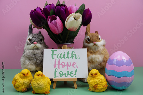 Fotografia Faith, Hope, Love! text with easter elements decoration on pink and green backgr
