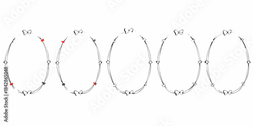 A collection of delicate silver necklaces with small red gemstone accents