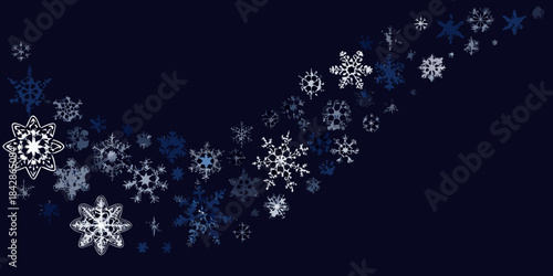 A cascade of delicate snowflakes drifting across a deep navy blue background