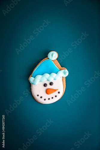 Gingerbread snowman on blue background