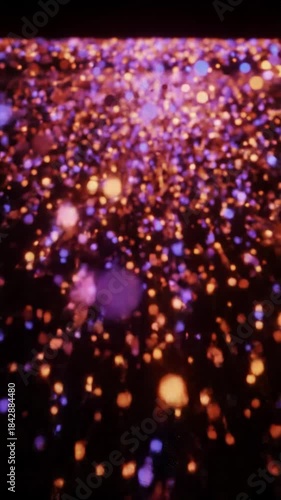 sleek abstract video of vibrant orange and red light particles bursting and expanding like data in an obsidian void, with a subtle forward dolly, creating a high-tech neural network. concept of