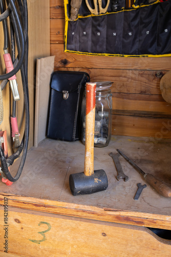 Tools and mallet on workbench in a woodworking workshop