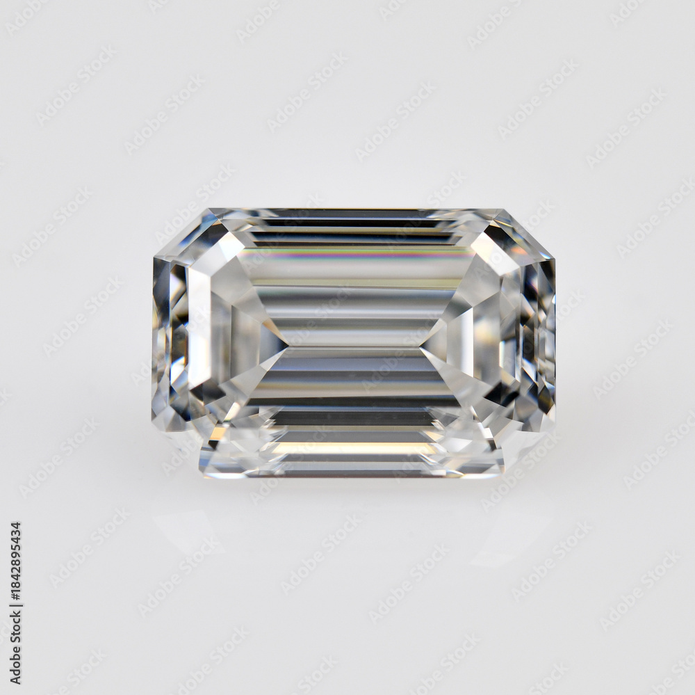 Fototapeta premium A white emerald cut diamond is sitting on a white background