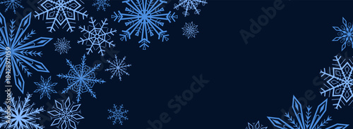 Winter background with blue snowflakes forming a decorative border on dark background. Perfect for Christmas and New Year banners, posters, cards, headers, web design and seasonal marketing materials
