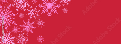 Festive winter background with pink snowflakes forming a decorative border on red background. Perfect for Christmas and New Year banners, posters, social media and seasonal marketing design