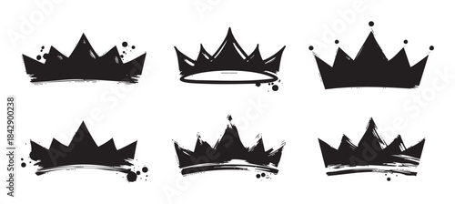 Six distinct grunge crown illustrations with artistic brush strokes and ink splatters symbolizing royalty, power, and success in a creative graphic design element set.