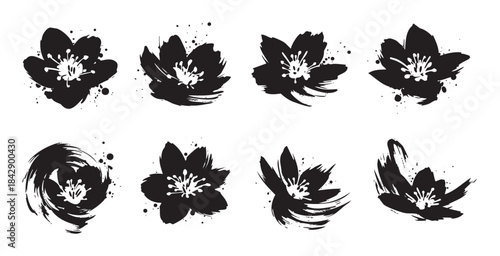 Stylized black flowers with expressive brush strokes and ink splatters are arranged in a collection, showcasing a modern artistic floral design.