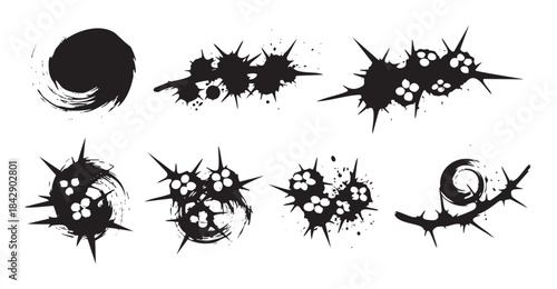 Abstract black ink grunge splatter shapes create a dynamic and edgy collection of artistic design elements with sharp points and textured details.