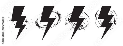 Four grunge lightning bolts with artistic splatter and brush stroke effects symbolize power, energy, and warning in a dynamic, distressed graphic style.