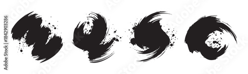 Abstract black ink brush strokes create a dynamic and artistic collection of grunge elements with splatters, perfect for graphic design projects.