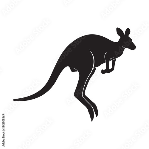 Silhouette of a kangaroo leaping across a grassy field