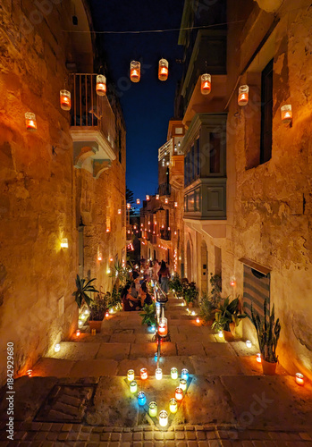 Famous maltese festival with a lot of street candles on the houses. Maltese island
