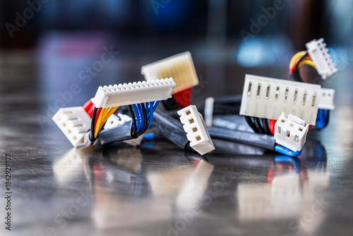 Electrical cable harnesses on the metal surface of the workshop