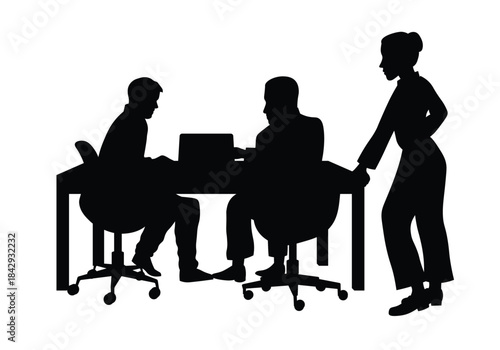 Business team collaborating at a desk with a laptop silhouette. Two businessmen and a businesswoman working together on a project in a modern office.