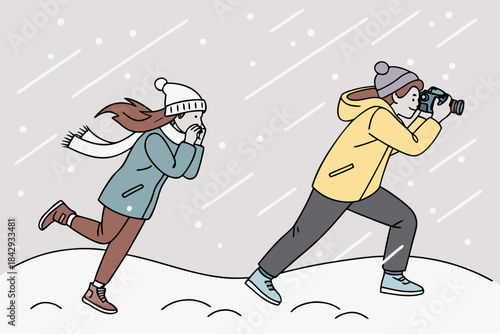 Winter Adventure Photographer and Cold Friend in Snow.