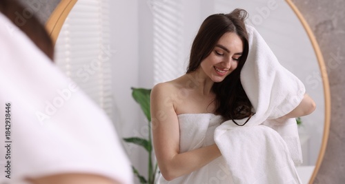 Free Download Beautiful woman drying hair with towel in bathroom - GFXLoad