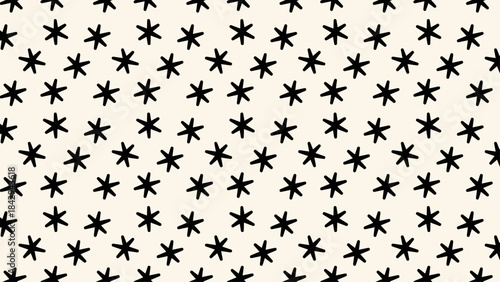 Starry seamless pattern with scattered tiny stars in playful hand-drawn style. Ideal for wrapping paper, kids décor, scrapbooking and festive designs.