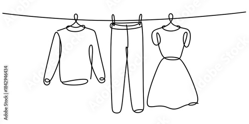 Continuous line drawing of clothing items hanging on a clothesline Vector, illustration