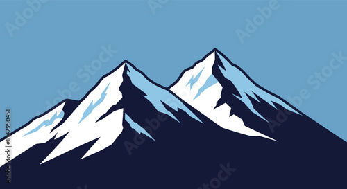 Two snowcapped mountains rise against a blue sky with rugged slopes forming a dramatic alpine landscape perfect for outdoor adventure and nature photography.