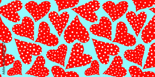 seamless cute pattern with scattered red polka dot hearts on a bright neon blue background baby shower birthday valentines day and playful kids textile print